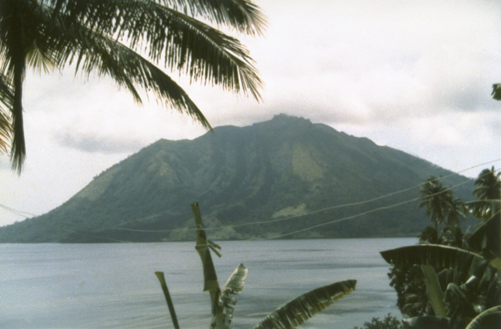 Ruang volcano, seen here from the nearby island of Tagulandang, forms a small 4 x 5 km island that is part of a chain of islands extending north from Sulawesi.  Explosive eruptions, recorded in historical time since 1808, have been accompanied by pyroclastic flows and lava dome formation, and have frequently caused damage to populated areas. Photo by Suratman (Volcanological Survey of Indonesia).