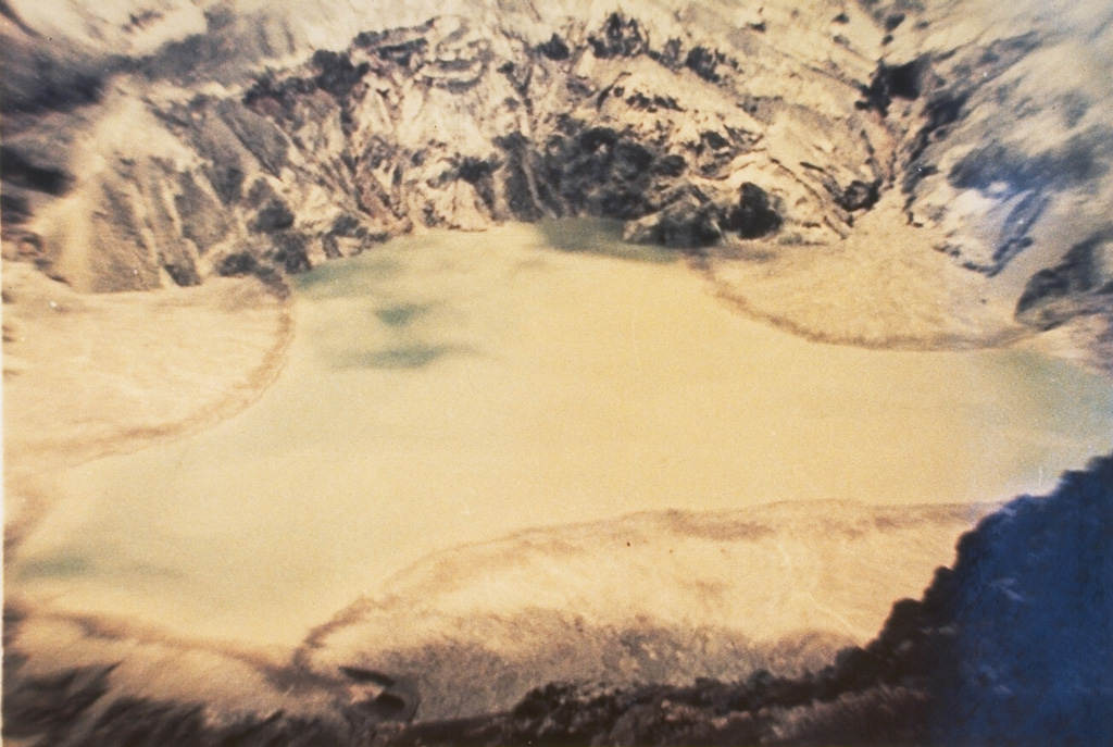 A 1.5-km-wide, 400-m-deep crater at the summit of Gunung Awu volcano has produced many powerful eruptions since the end of the 17th century, many accompanied by pyroclastic flows and lahars that devastated areas around the volcano.  Awu's crater contained a 170-m-deep crater lake in 1922, which was largely ejected during a major eruption in 1966, prior to this 1973 photo. Photo by K. Kusumadinata, 1973 (Volcanological Survey of Indonesia).
