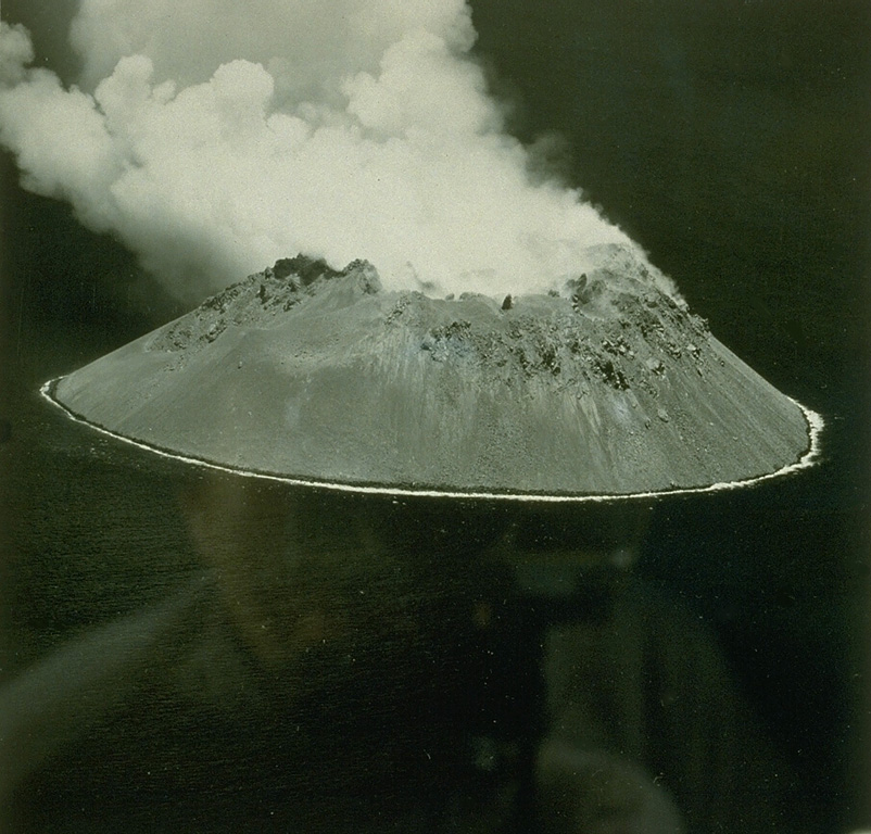 Didicas volcano forms a small, 1.4-km wide island in the Philippines, north of Luzon Island.  Prior to 1952, when a lava dome formed, the volcano was submarine.  A 5-acre island was first seen on March 16; this June 17 view shows the new steaming lava dome.  Submarine eruptions were reported in 1773, during 1856-1860 (when an ephemeral island was formed), and around 1900.   From the collection of Maurice and Katia Krafft.