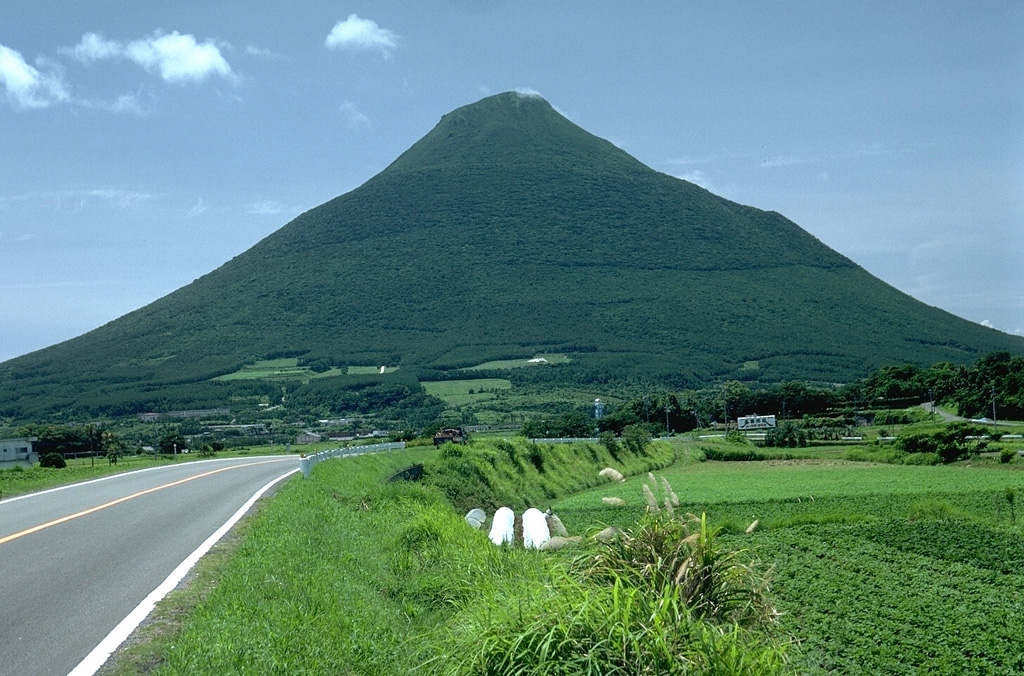 Weathering of volcanic ash releases nutrients that contribute to fertile soils for agriculture, such as these fields at the foot of Kaimon volcano in southern Kyushu. Because of this, population density is often high near volcanoes and results in communities developing in increasingly hazardous areas. Volcanic soils support crops such as rice fields in Indonesia, the Philippines, and Japan, sugar cane in Hawaii and Central America, and vineyards in Italy. Photo by Lee Siebert, 1988 (Smithsonian Institution).