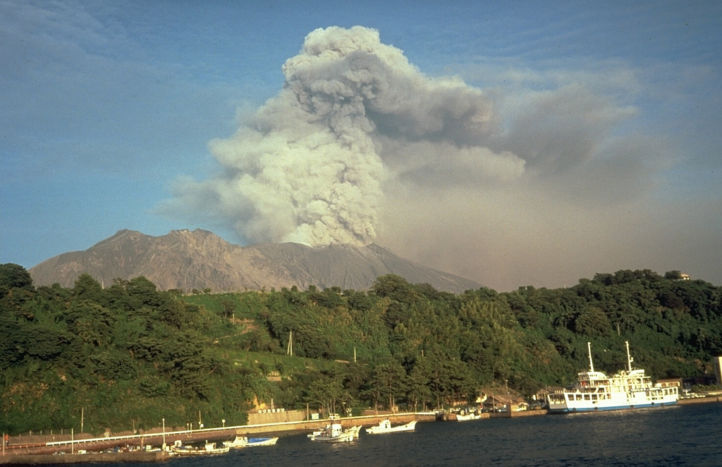 Sakurajima entered a period of frequent intermittent moderate explosions in October 1955. Ashfall from the active vent at Minamidake has often deposited ash on Kagoshima, southern Kyushu's largest city located 7 km across the bay. Ash plumes typically reach heights of 1-3 km above the vent. Lahars and ballistic block ejection have intermittently affected populated areas on the island. This September 1981 view shows an ash plume from the W. Photo by Dick Stoiber, 1981 (Dartmouth College).