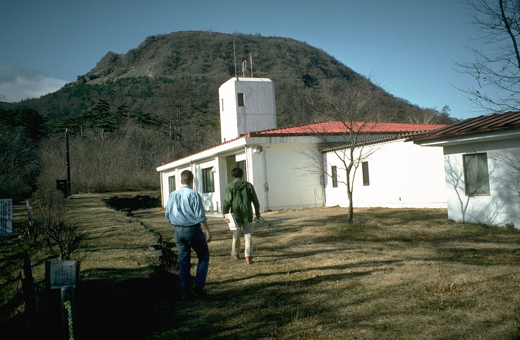 The Asamayama Volcano Observatory, operated by the University of Tokyo, is a base for geological, geophysical, and geochemical monitoring of the active volcano. The observatory is located on the E flank below Ko-Asamayama, the late-Pleistocene lava dome in the background that formed about 18,000 years ago. Photo by Tom Simkin, 1993 (Smithsonian Institution).