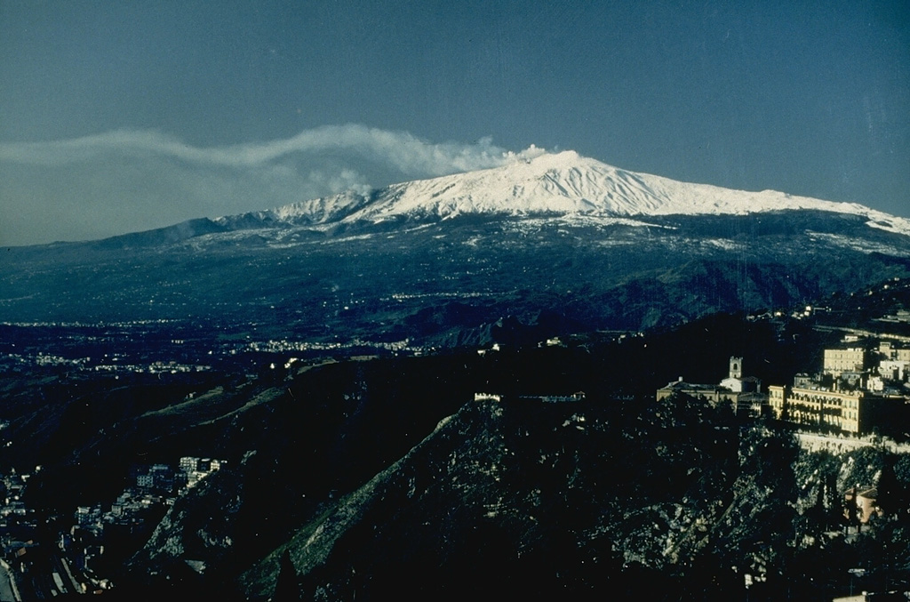 Etna is Europe's highest volcano, towering above the city of Taormina on its NE flank. One of the world's longest documented historical records continues, dating back to the 2nd millennium BCE. Historical lava flows cover much of the surface of this 40 x 60 km wide basaltic stratovolcano and extend to the sea. Eruptions occur both from persistently active summit craters and intermittently from flank fissures and cones. Photo by Jean-Claude Tanguy, 1991 (University of Paris).