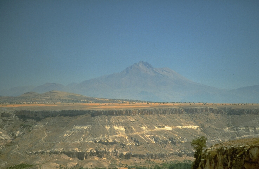 Erciyes Dagi volcano in central Turkey, seen here from the WSW, is an eroded stratovolcano that covers an area of 1,300 km2. Numerous parasitic cones and lava domes are concentrated on its northern flank.  Photo by Richard Waitt, 1994 (U.S. Geological Survey).
