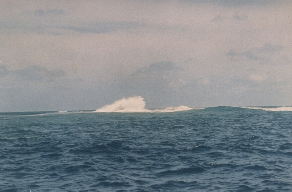 Waves break over Metis Shoal on 19 February 1968, more than a month after the end of a submarine eruption that began in December 1967 and produced an ephemeral island. Metis Shoal has produced a series of small islands during eruptions observed since the mid-19th century. An eruption in 1995 produced a lava dome that built up to 43 m above sea level. Photo by Charles Lundquist, 1968 (Smithsonian Astrophysical Observatory).
