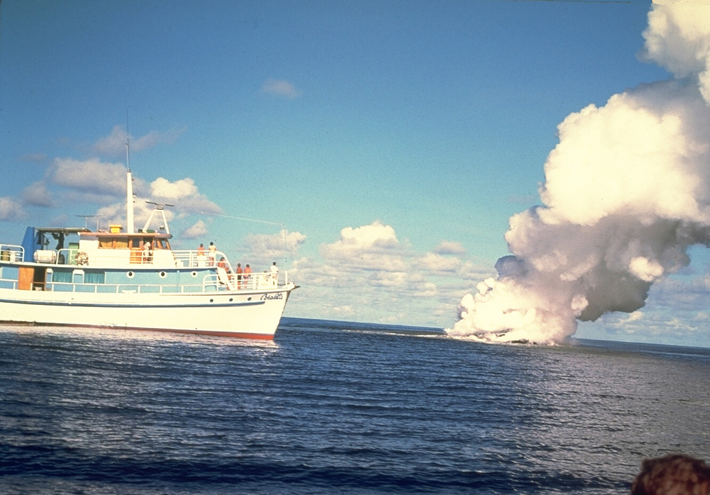 A submarine eruption from Kavachi volcano in July 1977. It is one of the most active submarine volcanoes in the SW Pacific, but is located far from major aircraft and shipping lanes. Sometimes referred to as Rejo te Kvachi ("Kavachi's Oven"), it has produced ephemeral islands up to 150 m long at least eight times since 1939.  Photo by W.G. Muller, 1978 (Barrier Reef Cruises, Queensland, Australia; courtesy of D. Tuni).