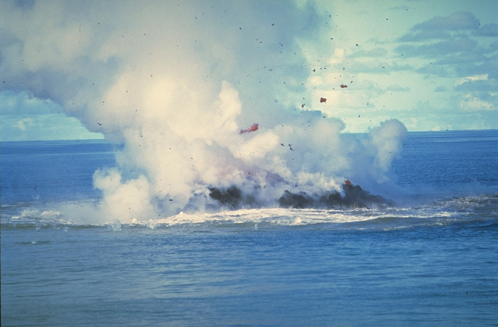 Clots of incandescent magma rise above Kavachi on 30 June 1978 after the vent of the submarine volcano had reached the sea surface. No eruptive activity was observed on 20 June, but there was an eruption the following day. On 22 June a 30-50 m island was observed erupting incandescent lava and gas and ash that rose a few thousand meters into the air. The eruption ended sometime between 16-28 July when observers on an overflight noted that the island was about 15 m wide and 3 m high. Photo by W.G. Muller, 1978 (Barrier Reef Cruises, Queensland, Australia; courtesy of D. Tuni).