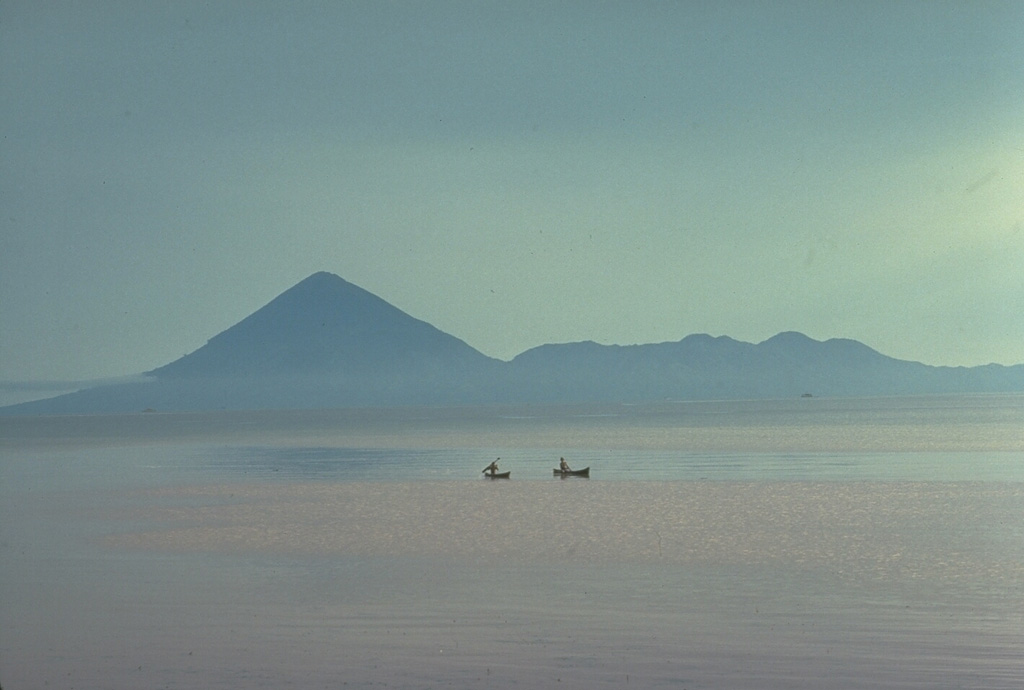 Tidore Island, in the Spice Islands of northern Maluku, is seen here looking W across the strait from Halmahera. It consists of the high conical Kie Matabu stratovolcano (left), and the broad truncated Telagao edifice (right) with a caldera containing two cones. Copyrighted photo by Katia and Maurice Krafft, 1976.