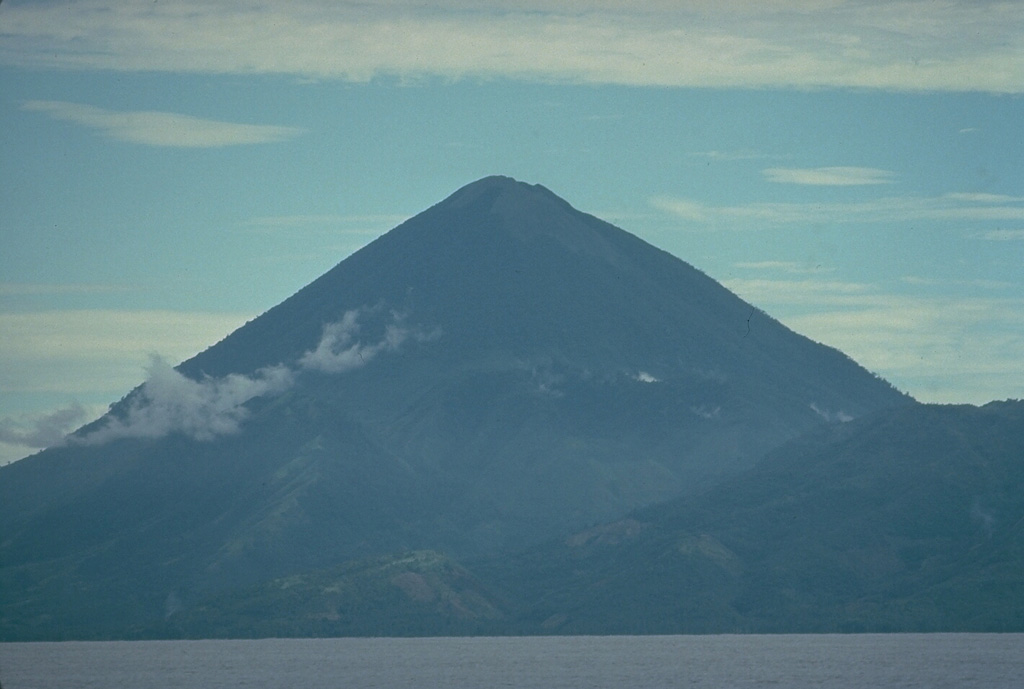 Kie Matubu volcano on Tidore Island, in the Spice Islands of northern Maluku off the western coast of Halmahera, is seen here from the NE across the strait between Halmahera and Tidore. Copyrighted photo by Katia and Maurice Krafft, 1976.