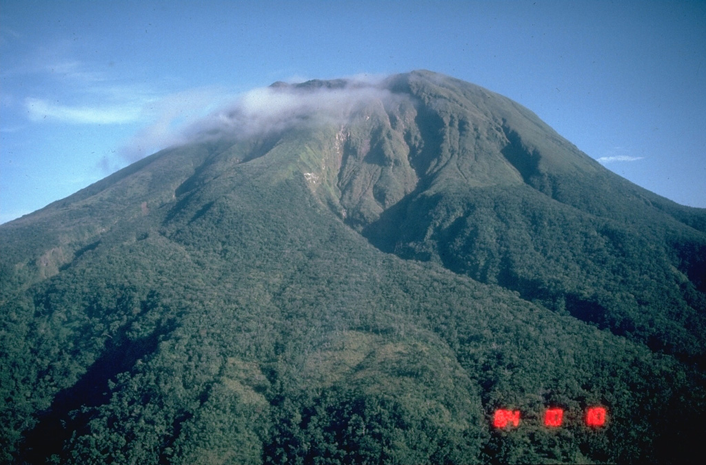 Bulusan, seen here from the W, is the southernmost volcano on the island of Luzon. It has formed within the 11-km-wide Irosin caldera along with other cones and domes. Frequent moderate explosive eruptions have been recorded since the mid-19th century from craters at the summit. Photo by Chris Newhall, 1984 (U.S. Geological Survey).