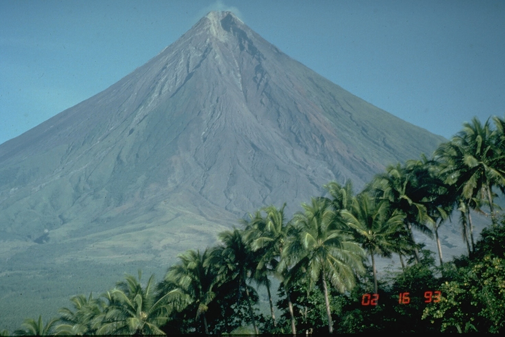 Mayon in the Philippines is one of Earth's best examples of a classic, conical stratovolcano. Its symmetrical morphology is the exception rather than the rule and is the result of eruptions that are restricted to a single central conduit at the summit. Eruptions are frequent enough to overcome erosion processes that quickly modify the slopes of most volcanoes. Photo by Chris Newhall, 1993 (U.S. Geological Survey).