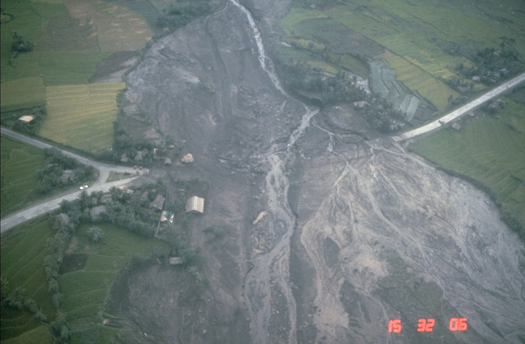 Lahars from the 1984 eruption of Mayon volcano swept down the NW and SW flanks. This 24 September view shows lahar deposits burying the highway at the Santa Domingo junction on the lower E flank, about 8 km from the summit. Lahars from this eruption reached the Albay Gulf at several points. Photo by Norm Banks, 1984 (U.S. Geological Survey).
