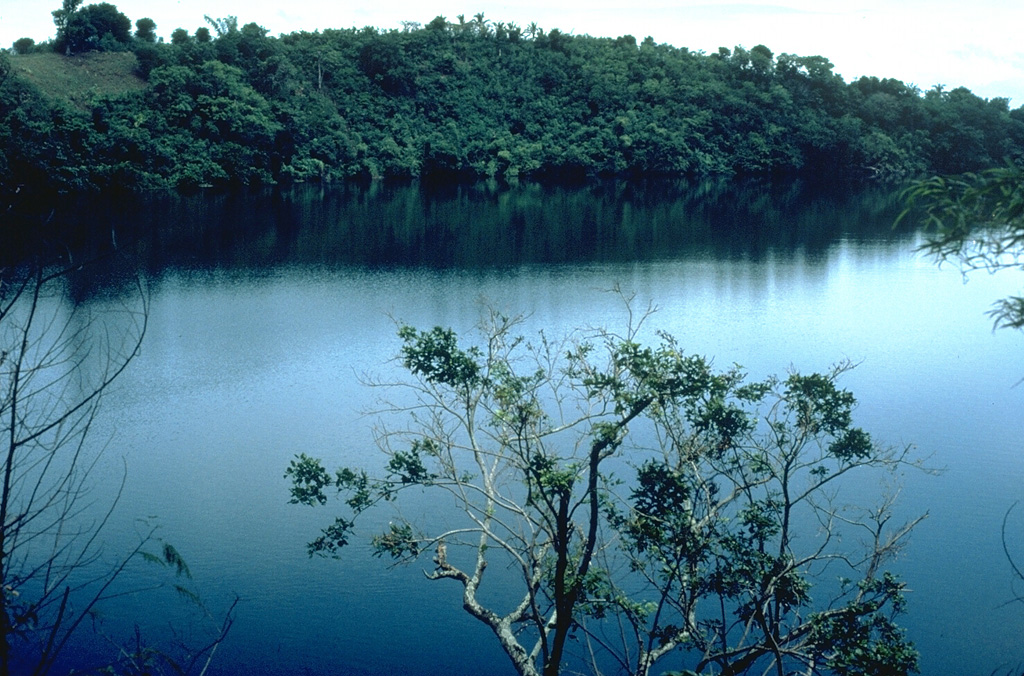 Alligator Lake, along the southern shore of Laguna de Bay, is one of a group of dozens of maars and scoria cones forming the San Pablo volcanic field (also known as the Laguna volcanic field). Three generations of maars are present, the youngest of which contain deep lakes. Many of the maars are located along a NE-SW trend. Local legends indicate that the most recent eruption occurred about 500-700 years ago at Sampaloc Lake, 17 km SE of Alligator Lake. Photo by Chris Newhall, 1989 (U.S. Geological Survey).