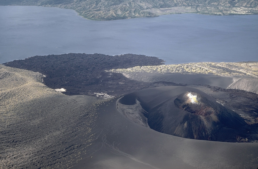 An eruption that began on 31 January 1968 produced the Mt. Tabaro scoria cone on Volcano Island in the Taal caldera. The lava flow  forming the lava delta was emplaced during this eruption, which lasted until 2 April. This December 1968 aerial view from the lava flow traveled to the lake within the crater produced during the major 1965 eruption. Photo by Kurt Frederickson, 1968 (Smithsonian Institution).