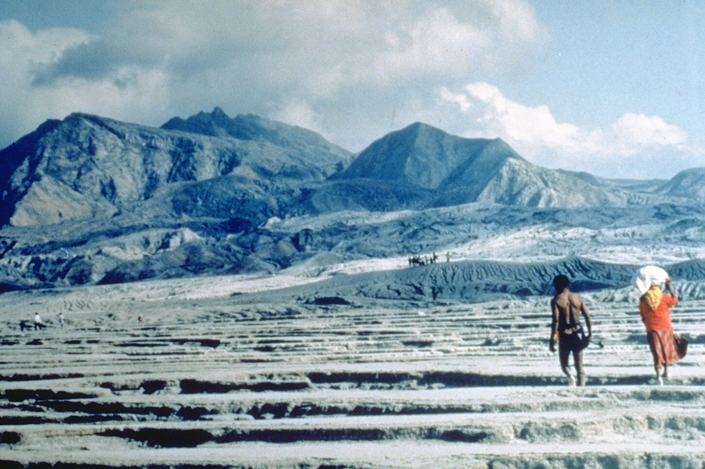 An Aeta couple returns to inspect their land along the Maraunot River on the NW flank of Pinatubo following the catastrophic eruption of 15 June 1991. At least 10,000 members of the nomadic Aeta peoples, whose native lands were on the slopes of Pinatubo, were displaced by the eruption. Photo by Ray Punongbayan (Philippine Institute of Volcanology and Seismology).