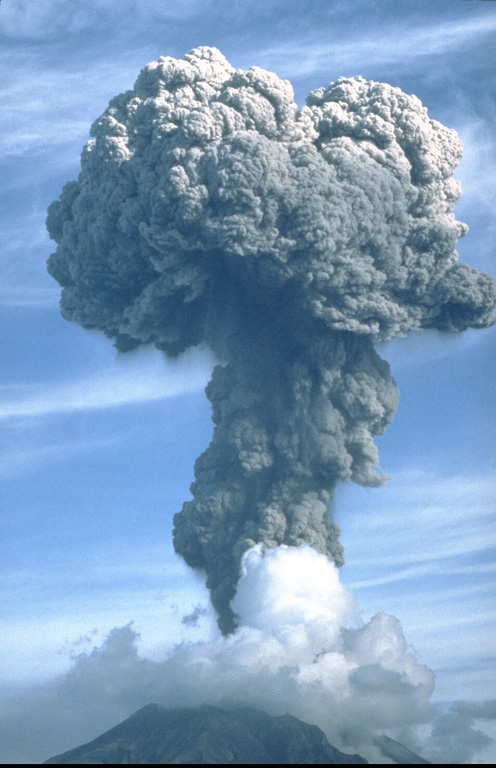 An ash plume rises above Sakurajima on 9 September 1985, where frequent explosive activity has occurred since October 1955. Eruption plumes typically rise 1-3 km above the vent, with occasional larger explosions. Ashfall commonly occurs over the island and periodically in Kagoshima City, 8 km to the west. Larger explosions eject ballistic blocks that have damaged structures on the island. Photo by Tom Pierson, 1985 (U.S. Geological Survey).