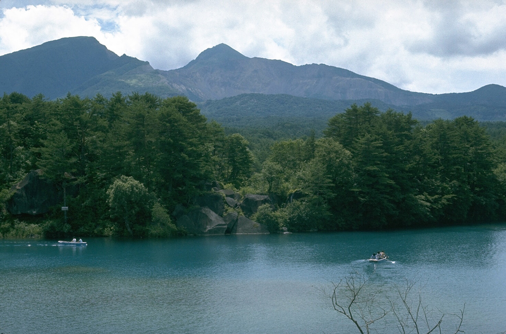 Collapse of the summit of Kobandaisan peak during a phreatic eruption at Bandaisan volcano in 1888 created the 1.5 x 2 km scarp seen here. The lake in the foreground was formed on the irregular surface of a 1.5 km3 debris avalanche deposit. The avalanche buried several villages and blocked river drainages, forming several new lakes. Ashfall from the eruption reached the Pacific coast of Honshu. Photo by Lee Siebert, 1988 (Smithsonian Institution).