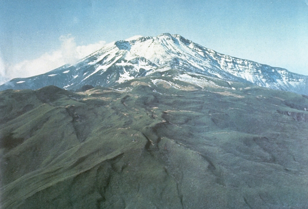 Chokaisan is the largest of the NE Honshu volcanoes, seen here from the NE. The volcano is comprised of two main overlapping edifices, the younger eastern area contains the large collapse scarp that was the source of the Kisakata debris avalanche, seen here opening to the N. Smaller cones later filled much of the area near the rear scarp. Photo courtesy Ichio Moriya (Kanazawa University).