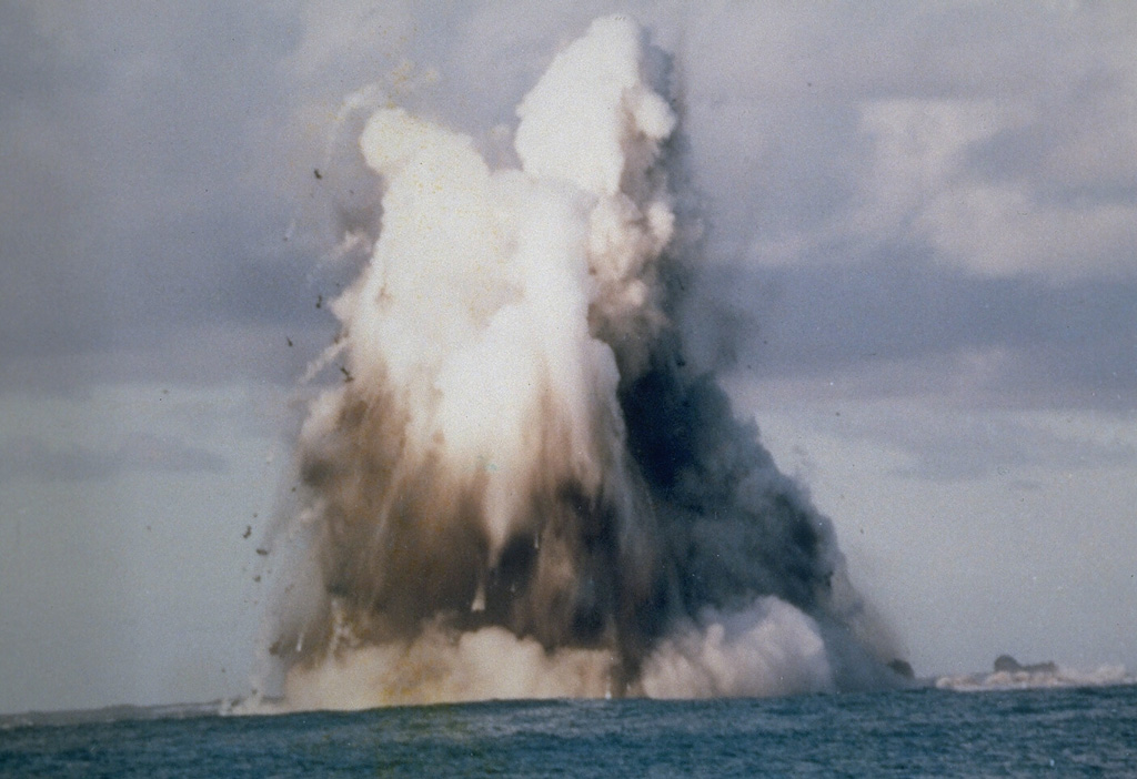 A submarine explosion from Nishinoshima breaches the surface on 9 October 1973. Steam trails behind ejected hot blocks at the margin of the plume. Submarine eruptions began on 12 April 1973 and the new island was first observed on 11 September. Lava flows began in September and three new islands were formed, which joined together during October-November 1973.  Photo courtesy of Japan Meteorological Agency, 1973.
