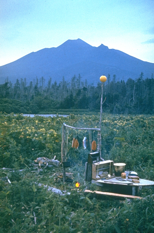 Chachadake volcano in northern Kunashir Island contains a smaller summit cone (center) that was constructed within a 2.1 x 2.4 km caldera. It contains recent lava flows that cover much of the SW caldera floor and also flowed over the rim, extending to the lower outer flank of the older caldera. Recent eruptions were recorded in 1812 and 1973. Photo by Yuri Doubik (Institute of Volcanology, Petropavlovsk).