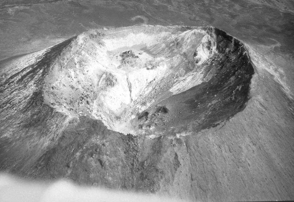 This 400-m-wide crater is at the summit of the cone that formed within the caldera at the summit of Chachadake on the NE tip of Kunashir Island. The SE part of the crater rim (upper right) is the highest point, seen here in October 1990.  Photo by A. Samoluk, 1990 (courtesy of Genrich Steinberg, Institute for Marine Geology and Geophysics, Yuzhno-Sakhalinsk).