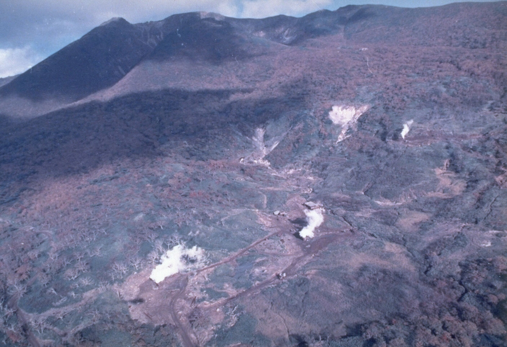 The Sashiusudake volcanic complex consists of an eroded Pleistocene edifice with a younger Holocene cone and summit lava dome. Geothermal activity continues at a SW-flank exploration area, seen here from the west. A small hydrothermal explosion took place at an exploratory well there in 1992. An eruption occurred in 1951 when local inhabitants reported weak explosive activity at the summit. Photo by T. Vendelin (courtesy of Genrich Steinberg, Institute for Marine Geology and Geophysics, Yuzhno-Sakhalinsk).