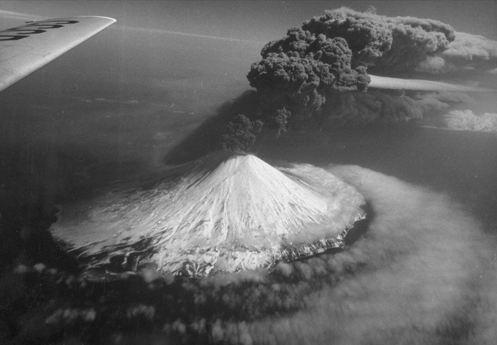 An ash plume rises above Alaid on 30 April 1981, at the peak of an eruption that began on 27 April (seen here from the N). The plume extended 2,000 km to the SE. The volcano has a 1.5-km-wide summit crater and numerous cones across the lower flanks. Explosive eruptions in 1790 and 1981 were among the largest in the Kuril Islands. Photo courtesy of Anatoli Khrenov, 1981 (Institute of Volcanology, Petropavlovsk).