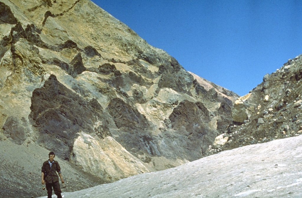 Dark-colored linear volcanic dikes, previous magma pathways, cut across altered pyroclastic rocks that are now exposed in the crater wall of northern Mutnovsky. Photo by Oleg Volynets, 1971 (Institute of Volcanology, Petropavlovsk).