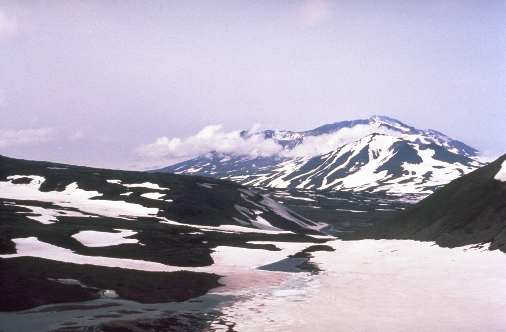 Part of the summit complex of Gorely is seen in this view from the S. It was constructed within a large caldera and contains 11 summit and 30 flank craters. Historical eruptions, largely consisting of moderate Vulcanian and phreatic explosions, have commonly produced ash plumes that are visible from Petropavlovsk, Kamchatka's largest city. Photo by Phil Austin, University of Southern Florida, 1992 (courtesy of Pavel Kepezhinskas).