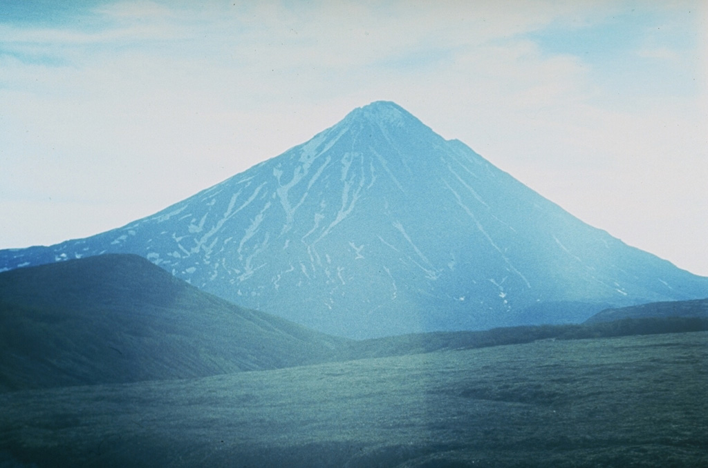 Opala volcano, seen here from the E, lies about 50 km W of the main volcanic arc in southern Kamchatka. The edifice was constructed at the N end of the 10 x 12 km, 40,000-year-old Opala caldera. Post-caldera Holocene volcanism included the extrusion of lava domes and flows. The latest major explosion formed the Barany amphitheater on the SE flank about 1,500 years ago. Photo by Andrei Tsvetkov.