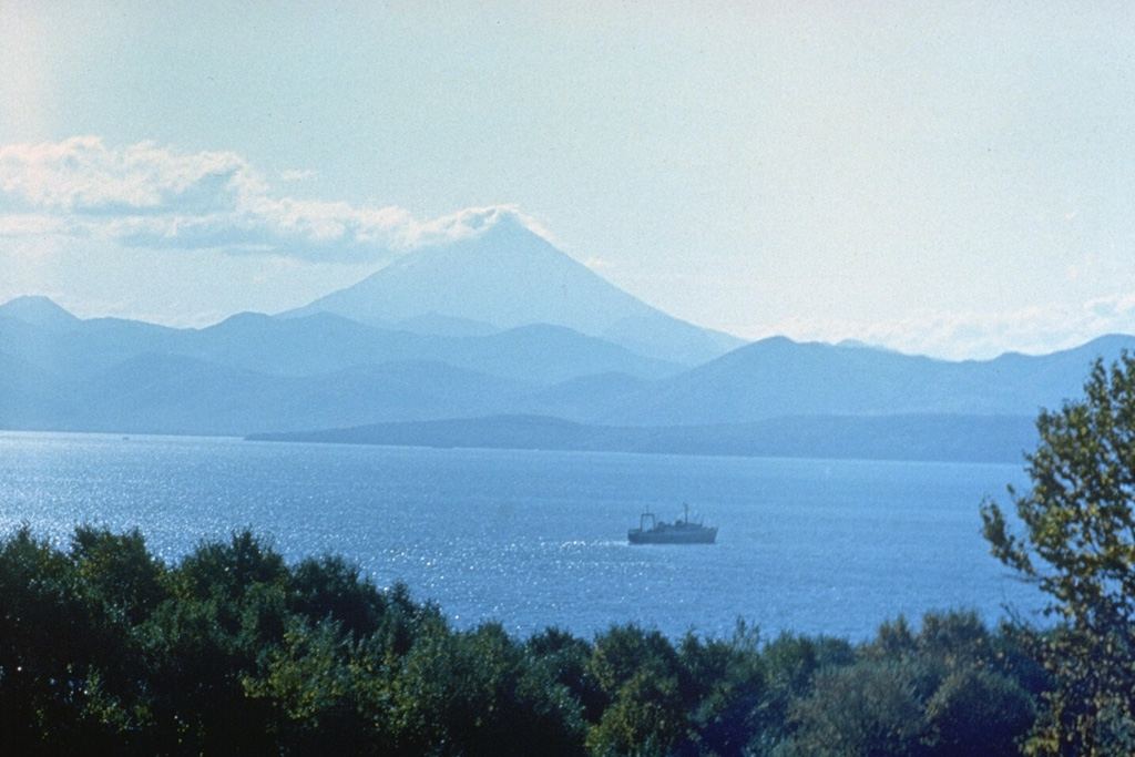 Vilyuchik is one of several volcanoes surrounding Avachinsky bay and is the most prominent peak visible to the south from Petropavlovsk. A meteorological cloud is to the east of the summit. Photo by Oleg Volynets, 1985 (Institute of Volcanology, Petropavlovsk).