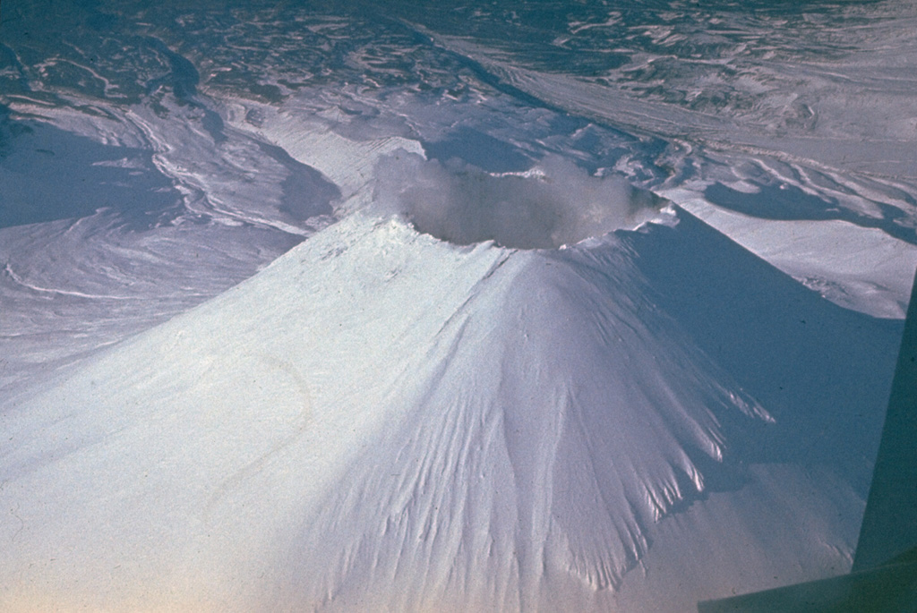 The Avachinsky cone was constructed during the late Pleistocene and Holocene within a horseshoe-shaped crater formed by late-Pleistocene flank collapse. The 250-m-deep summit crater seen in this view was completely filled with a lava during an eruption in 1991. Photo by Yuri Doubik (Institute of Volcanology, Petropavlovsk).