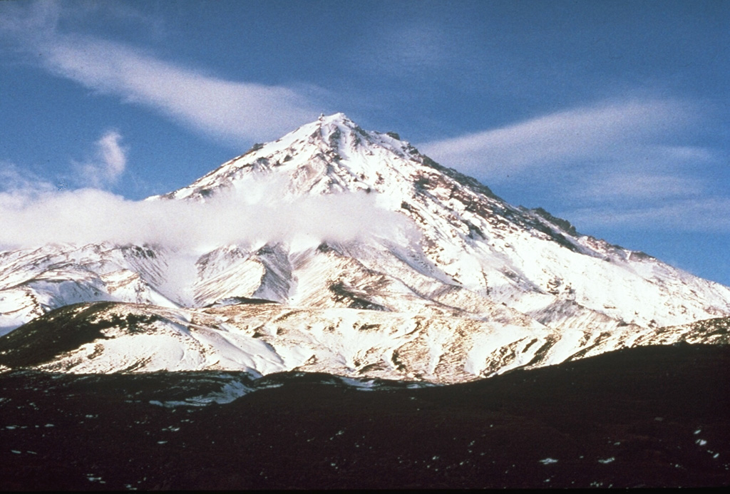 Bakening, seen here from the north, is located NW of Petropavlovsk, near the headwaters of the Srednaya Avacha River and well to the west of the eastern volcanic range of Kamchatka. Lava lava domes formed at the base and about 8,500-8,000 years ago the summit collapsed and produced a large debris avalanche to the SE. Photo by Pavel Kepezhinskas (University of Southern Florida).