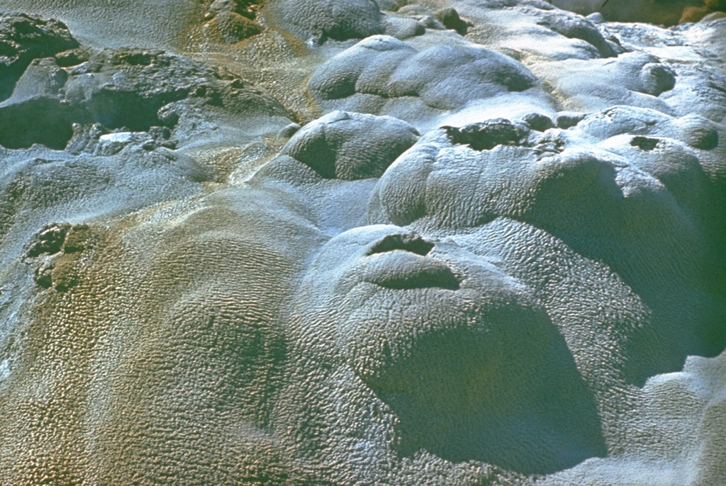 Extensive deposits of siliceous sinter have formed in the Valley of Geysers, a major geothermal area at the eastern end of the Uzon-Geysernaya caldera complex that contains 30 geysers. Photo by Yuri Doubik (Institute of Volcanology, Petropavlovsk).