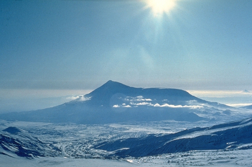 Tolbachik is composed of two main edifices. The flat-topped Plosky Tolbachik (right) is located east of the older and higher Ostry Tolbachik cone (left). Lengthy rift zones extending NE and S of Plosky Tolbachik have erupted voluminous lava flows through the Holocene. The 1975-76 eruption from the summit and S-flank fissures was one of the largest historical basaltic eruption in Kamchatka. Photo by Oleg Volynets (Institute of Volcanology, Petropavlovsk).