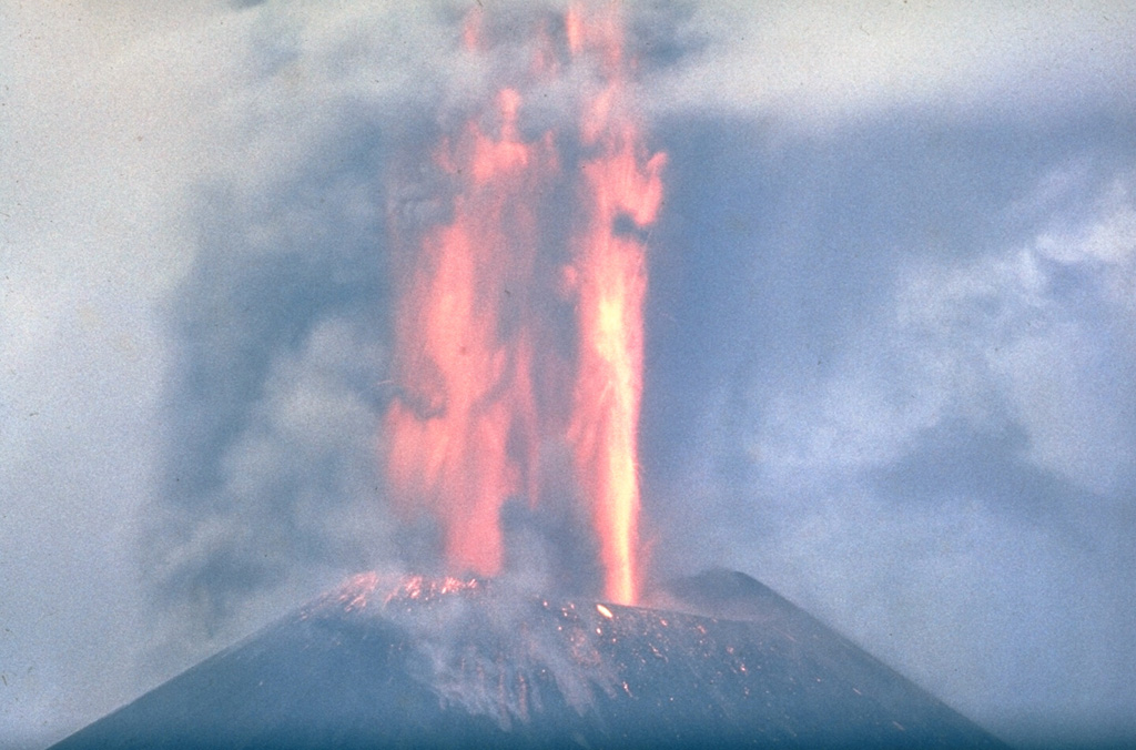 Lava fountaining at a scoria cone along Kamchatka's Tolbachik S-flank rift zone in late-July 1975. This was the first of three large cones that formed along the northern part of the rift zone during the early stage of the eruption. The lava fountains reached heights up to 1-2.5 km above the vent and ash plumes rose 10-18 km. After 27 July, eruptions from the first cone were dominantly effusive. Activity at the first cone ceased on 9 August. Photo by Oleg Volynets, 1975 (Institute of Volcanology, Petropavlovsk).