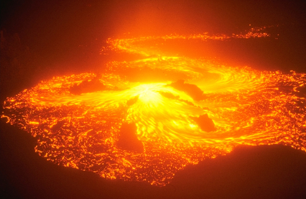 Incandescent lava flows from the southern eruptive center of the "Great Tolbachik Fissure Eruption" in January 1976. Activity from the southern center, which began on 18 September 1976, was dominantly effusive. By the time the eruption ended in December 1976 the southern vent had produced a lava field that covered 40 km2 to an average thickness of 28 m. Photo by Oleg Volynets, 1976 (Institute of Volcanology, Petropavlovsk).