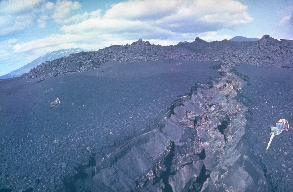 On 6 July 1975 a new fissure opened along the south rift zone of Tolbachik volcano during the "Great Tolbachik Fissure Eruption" of 1975-76, ending on 10 December 1976. Scoria cones grew to nearly 300 m high at the northern end of the 30-km-long eruption zone, with lava sheets covering more than 40 km2. Photo by Yuri Doubik, 1975 (Institute of Volcanology, Petropavlovsk).