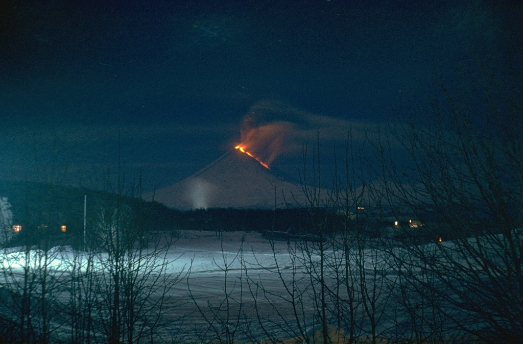 A lava flow travels down the NW flank of Klyuchevskoy in this January 1986 view from the town of Klyuchi. Explosive activity commenced at the summit on 16 August 1985 and lava flow emission began on 5 November, accompanied by intensive summit explosive activity. On 2 December strong phreatic explosions from a NW flank fissure ejected material that reached 10 km, and on 1-2 December, a mudflow traveled 35 km. The summit crater eruption ended on 21 January 1986. Photo by Alexander Belousov, 1986 (Institute of Volcanology, Kamchatka, Russia).
