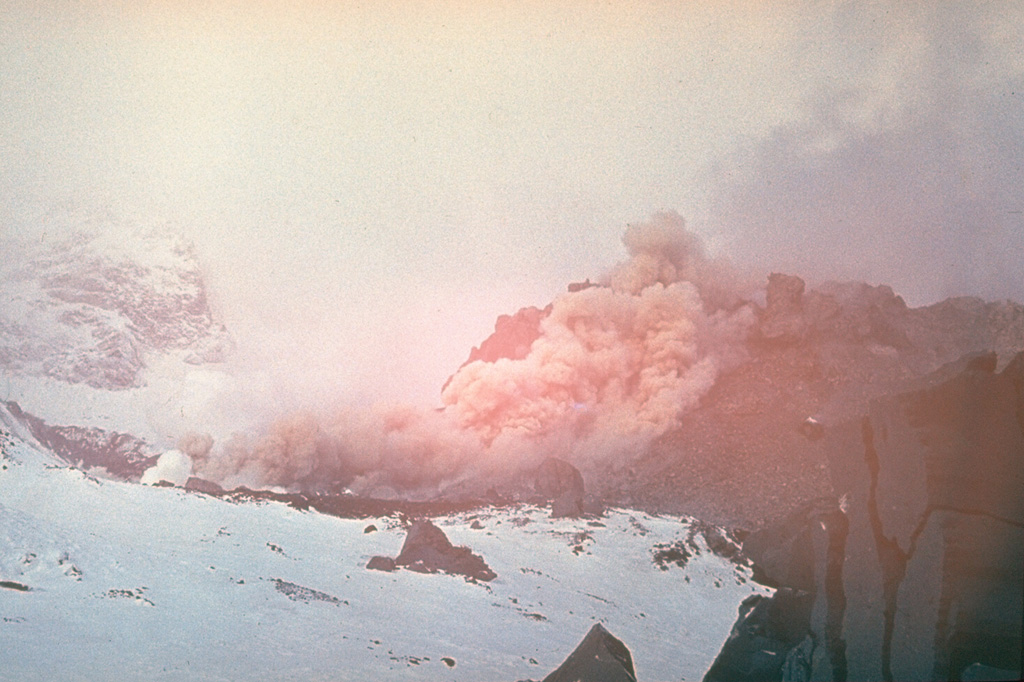 A block-and-ash flow descends the lava dome in the crater of Sheveluch; it eventually reached 1.5 km from the dome. Growth of the dome recommenced on 23 August 1980. By the time the eruption ended in late 1981 the dome had reached a height of 180 m and a diameter of 350 m.  Photo by Yuri Doubik (Institute of Volcanology, Petropavlovsk).