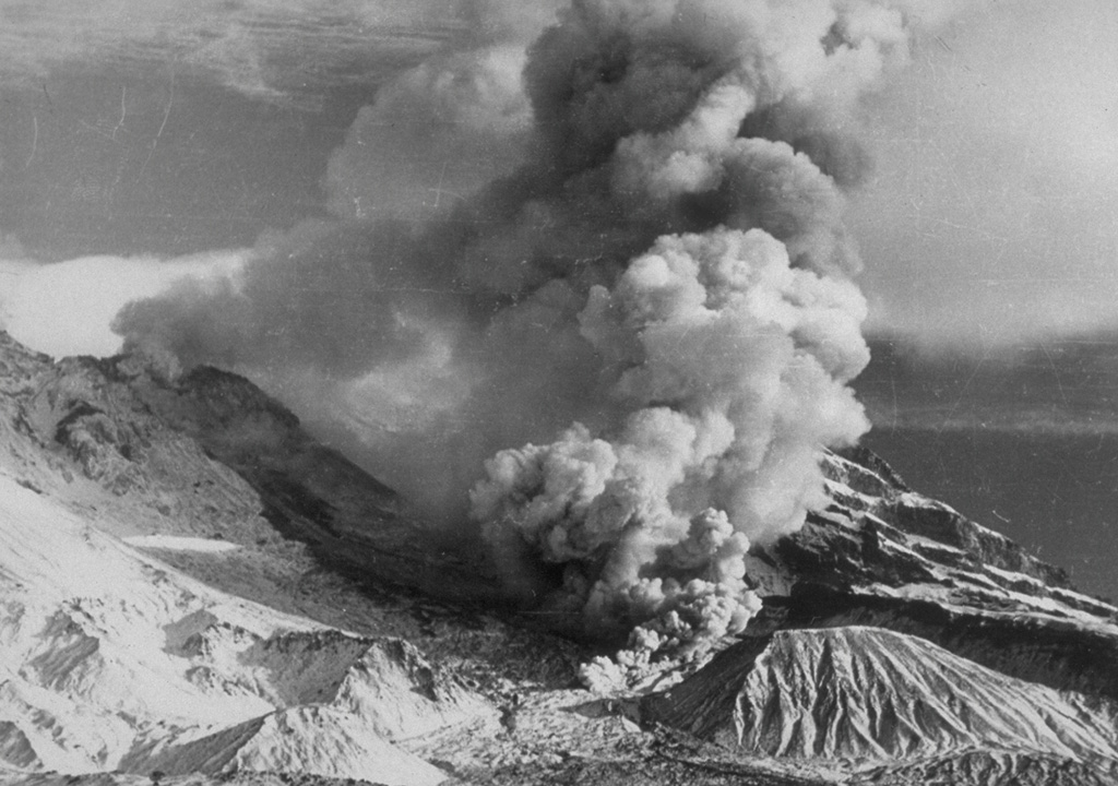 Ash clouds rise in 1948 above a pyroclastic flow descending the flanks of a lava dome growing in the crater of Shiveluch volcano, seen here from the south.  Explosive activity beginning in late 1944 became more frequent and powerful prior to the onset of dome growth in 1946.  By the time dome growth ceased in 1949, the Suelich dome had a height of 500-600 m and a diameter of 1 km.  Explosive eruptions continued intermittently until April 1950.  This marked the last eruptive activity of Shiveluch prior to a catastrophic eruption in 1964. From the collection of Maurice and Katia Krafft.