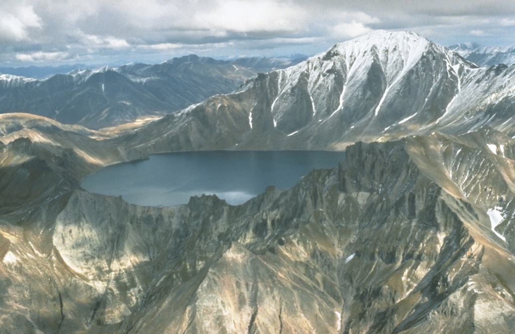 Khangar is the southernmost volcano of the N-S-trending Sredinny Range, which stretches across western Kamchatka. It contains a 2.8-km-wide summit crater and a large lava dome on its eastern flank. The crater formed about 7,000 years ago and is now partially filled by a lake. Photo by Dan Miller, 1990 (U.S. Geological Survey).