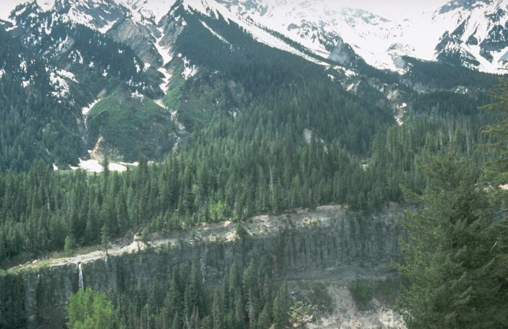 The pyroclastic flow deposit forming the foreground canyon wall on the Lillooet River was erupted from the Bridge River vent on the NE flank of the Meager volcanic complex. A vent to the upper right, below the notch in the skyline, was the source of an explosive eruption about 2,350 years ago. It produced ash that dispersed east across British Columbia and Alberta, the pyroclastic flow mentioned here, and a 3-km-long rhyodacite lava flow. Photo by Willie Scott, 1990 (U.S. Geological Survey).