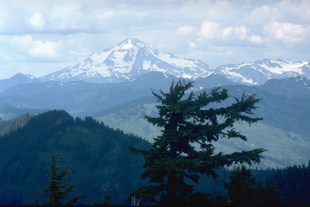 Glacier Peak has produced large explosive eruptions that have dispersed major tephra deposits over broad distances and has been frequently active during the past 5,500 years. Its eruptions were accompanied by lava dome growth, pyroclastic flows, and lahars that traveled to lowland areas far from the volcano.  Photo by Lee Siebert, 1990 (Smithsonian Institution).