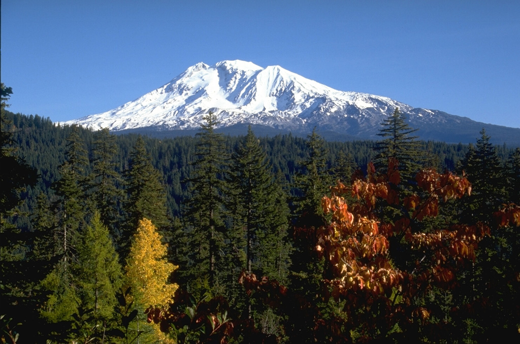Mount Adams in the southern Cascade Range of Washington in seen from the SW in this view. The large cirque below the left side of the summit is occupied by the White Salmon and Avalanche Glaciers and was the source of a large mudflow that traveled 60 km down the White Salmon River valley about 6,000 years ago. Photo by Lee Siebert, 1995 (Smithsonian Institution).