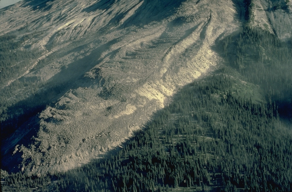 The prominent lava flow known informally as "The Mitten" was part of a large complex of lava flows erupted from the summit of Mount St. Helens that traveled down the SE flank to the base of the volcano.  Stratigraphic evidence dates these flows to the first half of the 16th century. Copyrighted photo by Katia and Maurice Krafft, 1980.