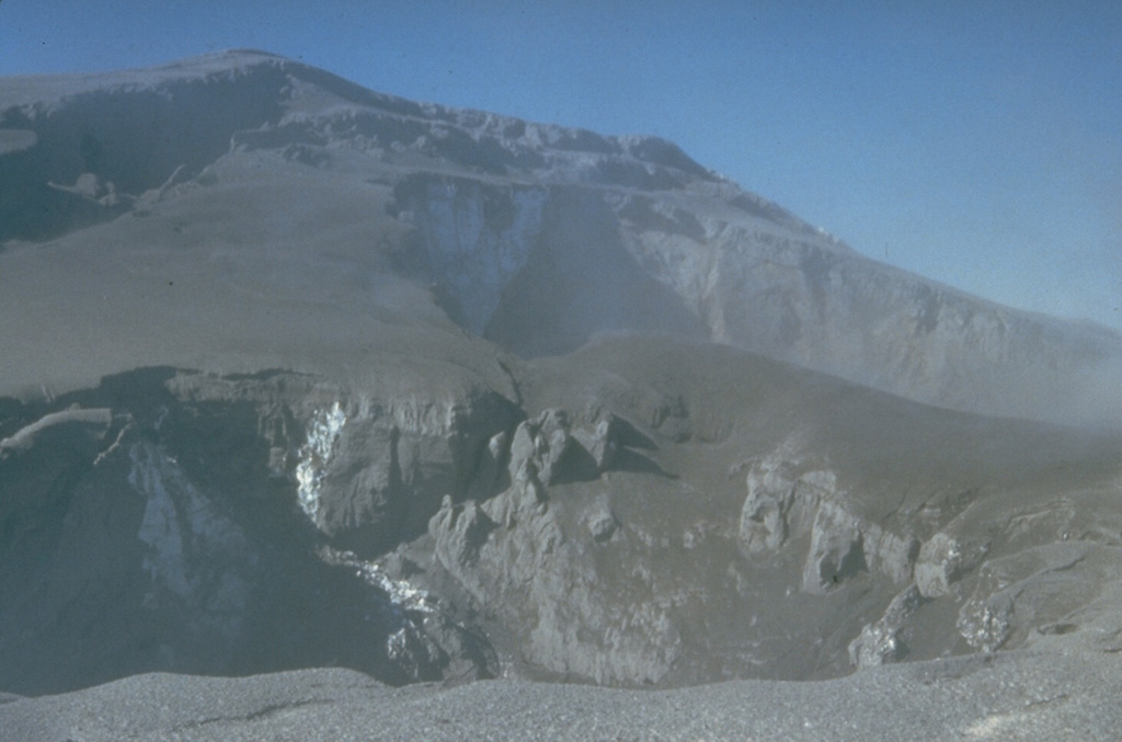 This 30 March 1980 photograph shows two new summit craters formed by phreatic eruptions at Mount St. Helens beginning on 27 March. Continued explosions soon merged the craters into a single crater 300 x 500 m wide and up to 250 m deep. Photo by Don Swanson, 1980 (U.S. Geological Survey).