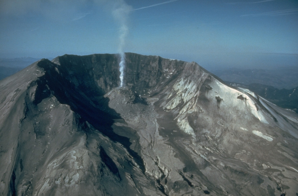 The large, horseshoe-shaped crater left by the collapse of Mount St. Helens on 18 May 1980, is typical of scarps created by massive volcanic landslides. The collapse removed nearly 1 km of the summit, leaving a 2 x 3.5 km crater open to the north. This June 1982 view shows a lava dome that began growing within the new crater. Photo by Steve Brantley, 1982 (U.S. Geological Survey).