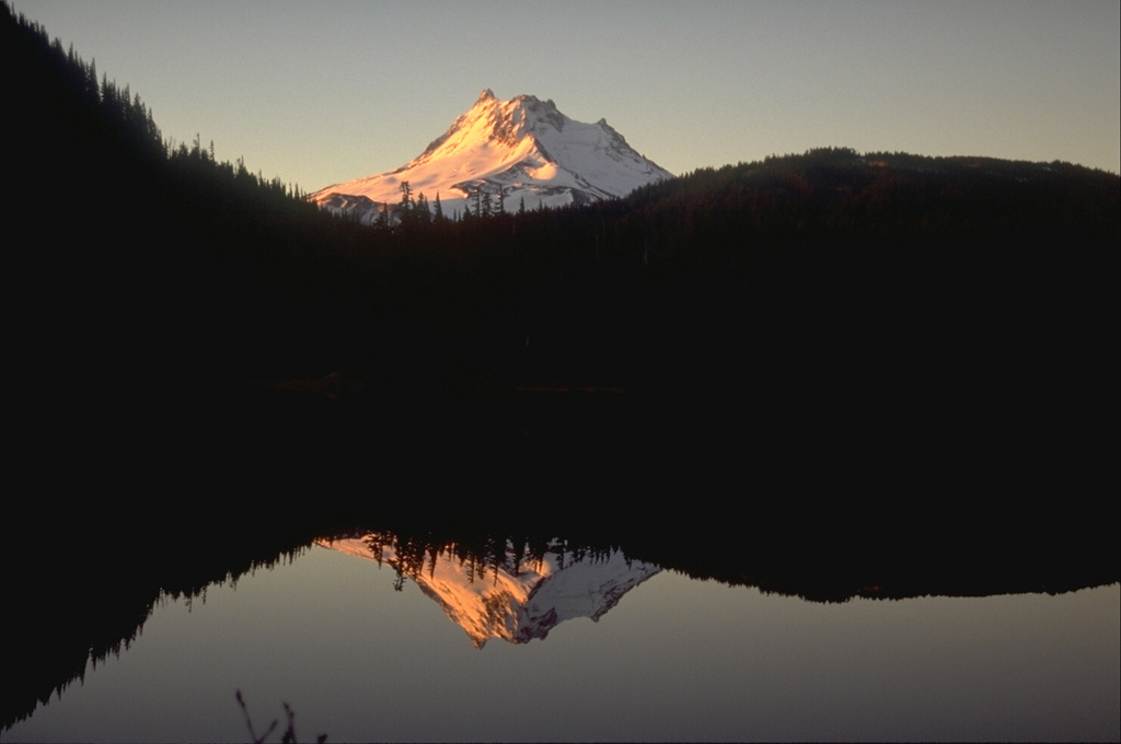 Mount Jefferson rises above Breitenbush Lake to the north. The glacially eroded volcano has not erupted since the late Pleistocene, although flank vents to the south that are not associated with the main edifice have been active since 7,700 years ago. Photo by Lee Siebert, 1995 (Smithsonian Institution).