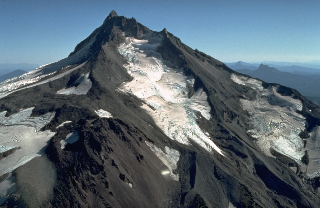Mount Jefferson has been inactive since the late Pleistocene and shows the effect of extensive erosion by glaciers. The Jefferson Park Glacier on the N flank in the foreground and the Whitewater Glacier on the E flank are the two largest on Jefferson. Photo by Dan Miller, 1977 (U.S. Geological Survey).